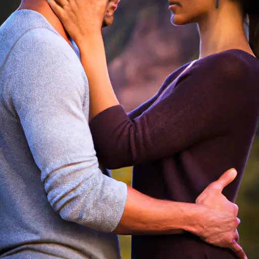 An image capturing a couple standing close, hands entwined while facing each other, their eyes locked in an intimate gaze