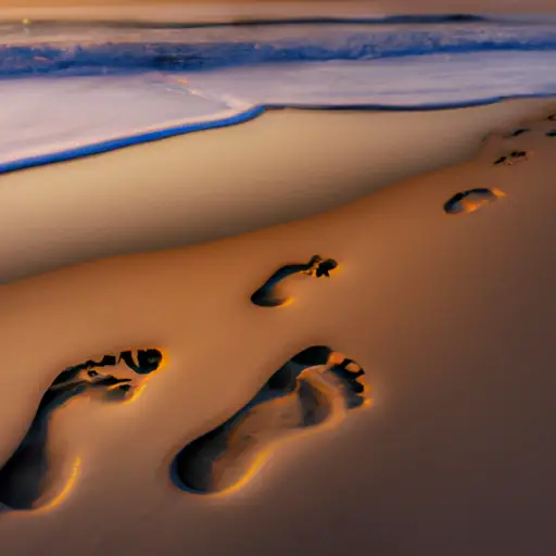 An image capturing the essence of navigating an age gap crush: a sunset beach scene with two sets of footprints side by side in the sand, one pair smaller and one pair bigger, symbolizing the connection between a younger guy and his admirer