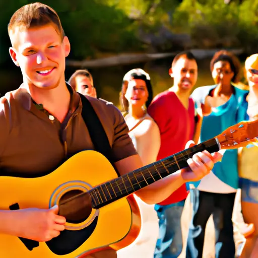 An image showcasing a well-groomed, confident guy with a genuine smile, wearing a stylish outfit and holding a guitar, surrounded by a diverse group of friends, enjoying a fun outdoor activity