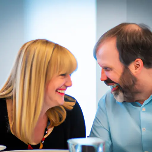 An image featuring a vibrant office setting with a couple sharing a warm smile as they enjoy a lunch break together, showcasing the benefits of dating a coworker such as shared laughter and increased connection