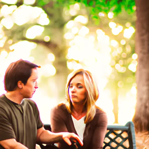 An image featuring two people sitting on a park bench, engrossed in an intimate conversation