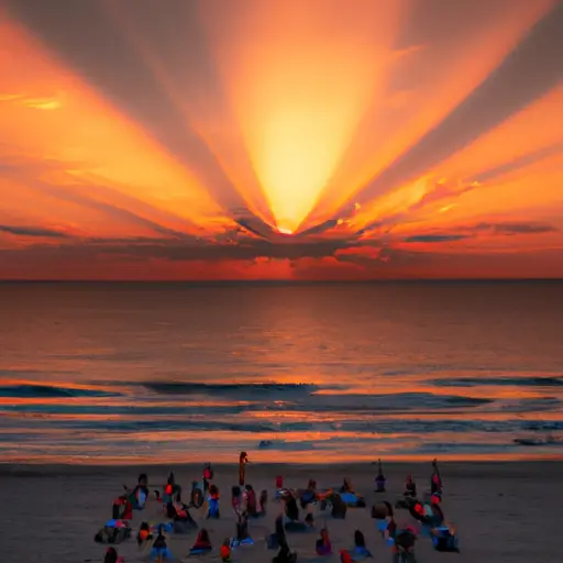 An image showcasing a vibrant sunrise over a serene beach, with colorful rays of light breaking through the clouds, casting a warm glow on a group of people practicing yoga and embracing positivity