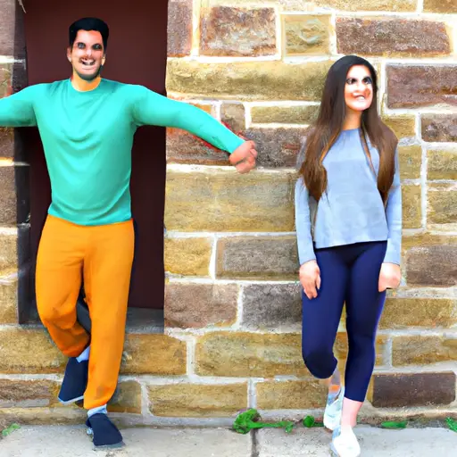 An image showing a guy leaning against a wall with a relaxed posture, hands in pockets, while a girl stands a few feet away, smiling subtly, as they both maintain eye contact