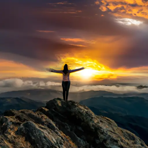 An image of a person standing on a mountaintop, arms wide open, surrounded by a vibrant sunrise