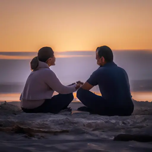 An image featuring a couple sitting on a peaceful beach, holding hands, calmly discussing their differences while a sunset casts a warm glow