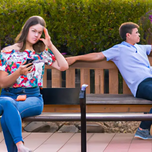 An image capturing a woman sitting alone on a park bench, engrossed in her phone while a guy stands nearby, looking disinterested