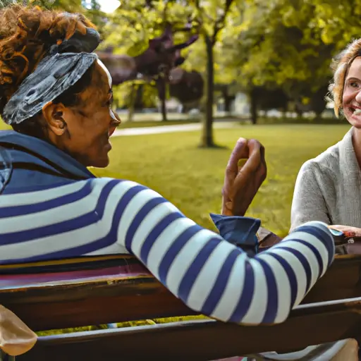 An image of two people sitting face-to-face on a park bench, engrossed in conversation